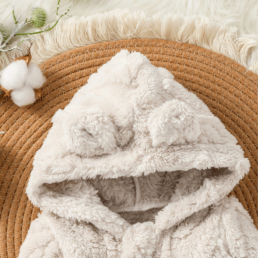 nid-d'ange-gigoteuse-bebe-wintercosy-quotidien-familiale-voyage-transport-sieste-en-déplacement-polyvalence-parent-actif-moderne-stylé-chaleureux-semblant-laine-mignon-adorable-cocon-douillet-capuche-oreille-animal