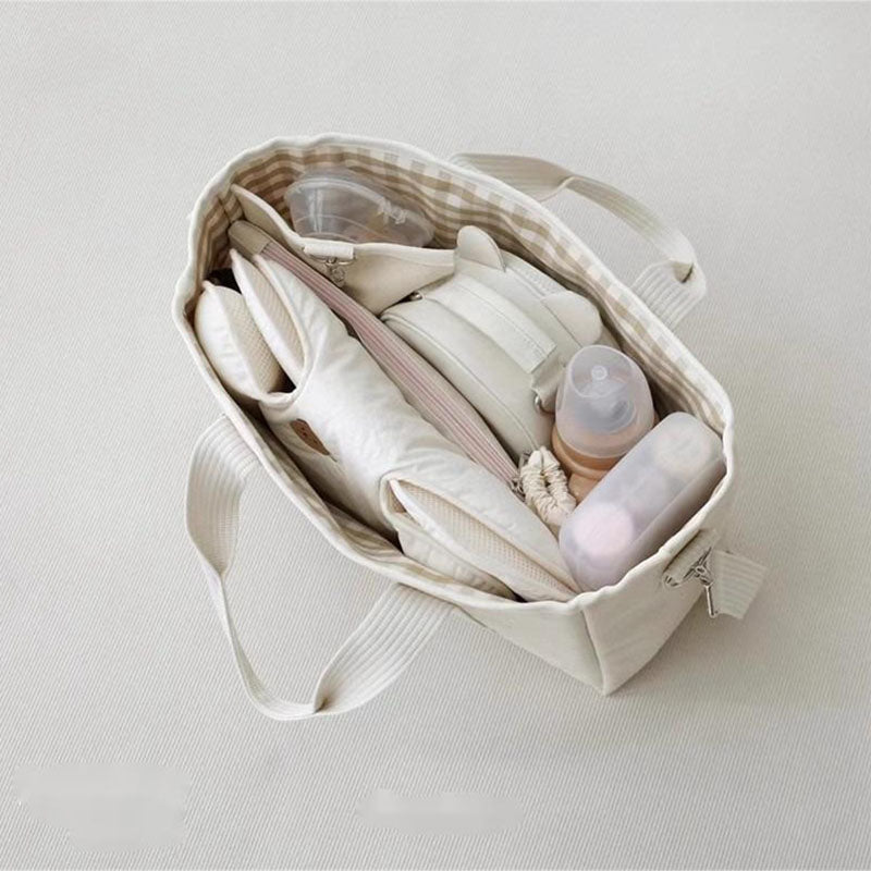 sac-a-langer-maman-organisation-bebe-fermeture-lacet-sorties-prepare-avec-bebe-mom-parent-sac-a-couche-mignon-accessoire-transport-bébé-boutique-joie-de-bébé