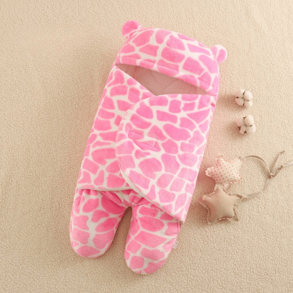 gigoteuse-nid-d'ange-rose-forme-pierre-rose-pierre-enveloppe-chaleureuse-sieste-bebe-joie-de-bébé-accessoire-transport-voyage-deplacement-avec-bébé-cadeau-idéal-must-have-bonne-humeur-avec-bébé-dort-must-have