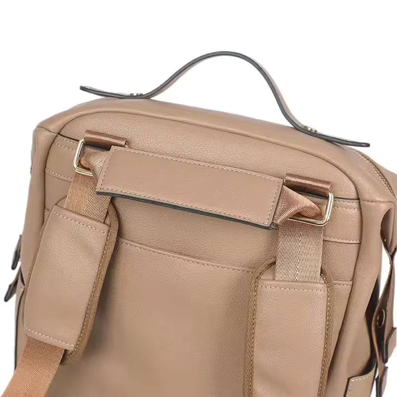 sac-a-langer-brun-cuir-iconique-multifonction-sac-a-dos-a-langer-sac-moderne-mode-accessoire-sorties-bébé-joie-de-bébé