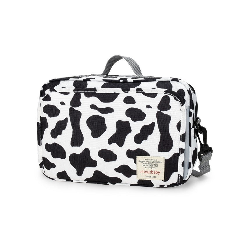 sac-à-langer-noir-bandouliere-sangle-poussette-motif-vache-