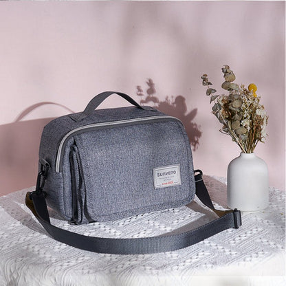 sac-a-langer-station-gris-modèle-épuré-cute-pratique-moderne-multifonctionnel-accessoire-indispensable-parent-actif-en-déplacement-avec-bébé
