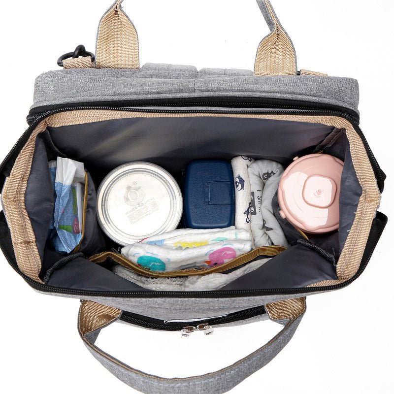 sac-a-langer-vue-interieur-plusieurs-poches-separatrices-biberons-couche-lit-integré-joie-de-bébé