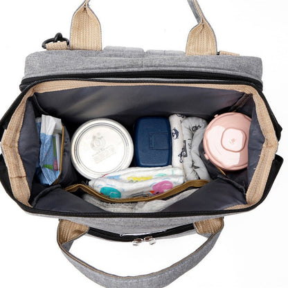 sac-a-langer-vue-interieur-plusieurs-poches-separatrices-biberons-couche-lit-integré-joie-de-bébé
